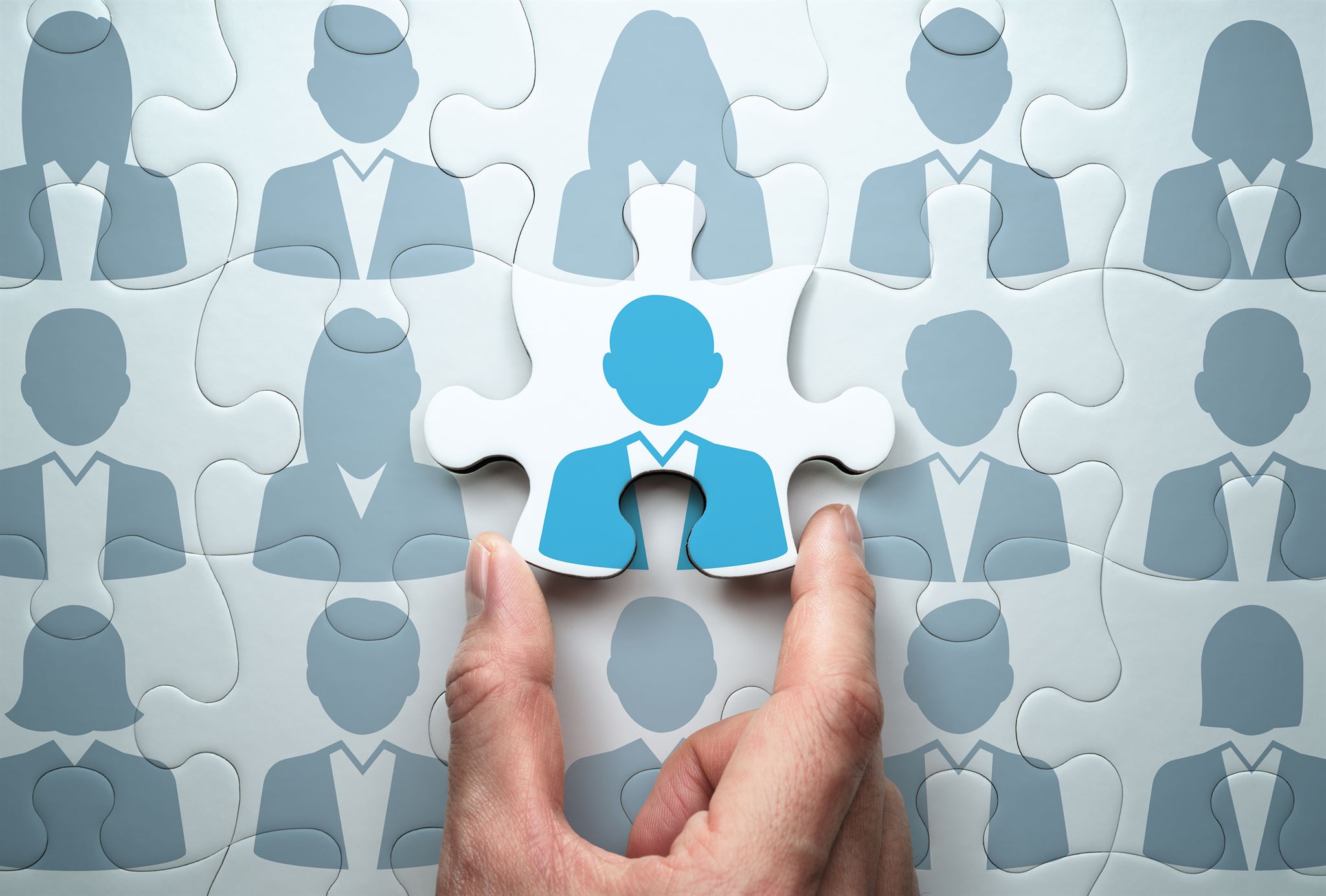 Person-holding-a-puzzle-piece